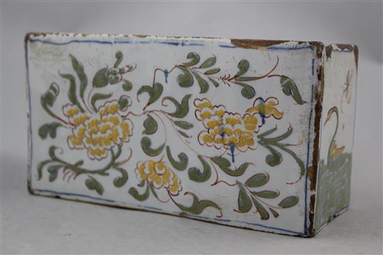 An English delftware polychrome flower brick, c.1760, possibly Liverpool, 17.5cm.